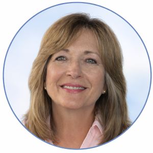 Professional headshot with soft blue accents 300x300